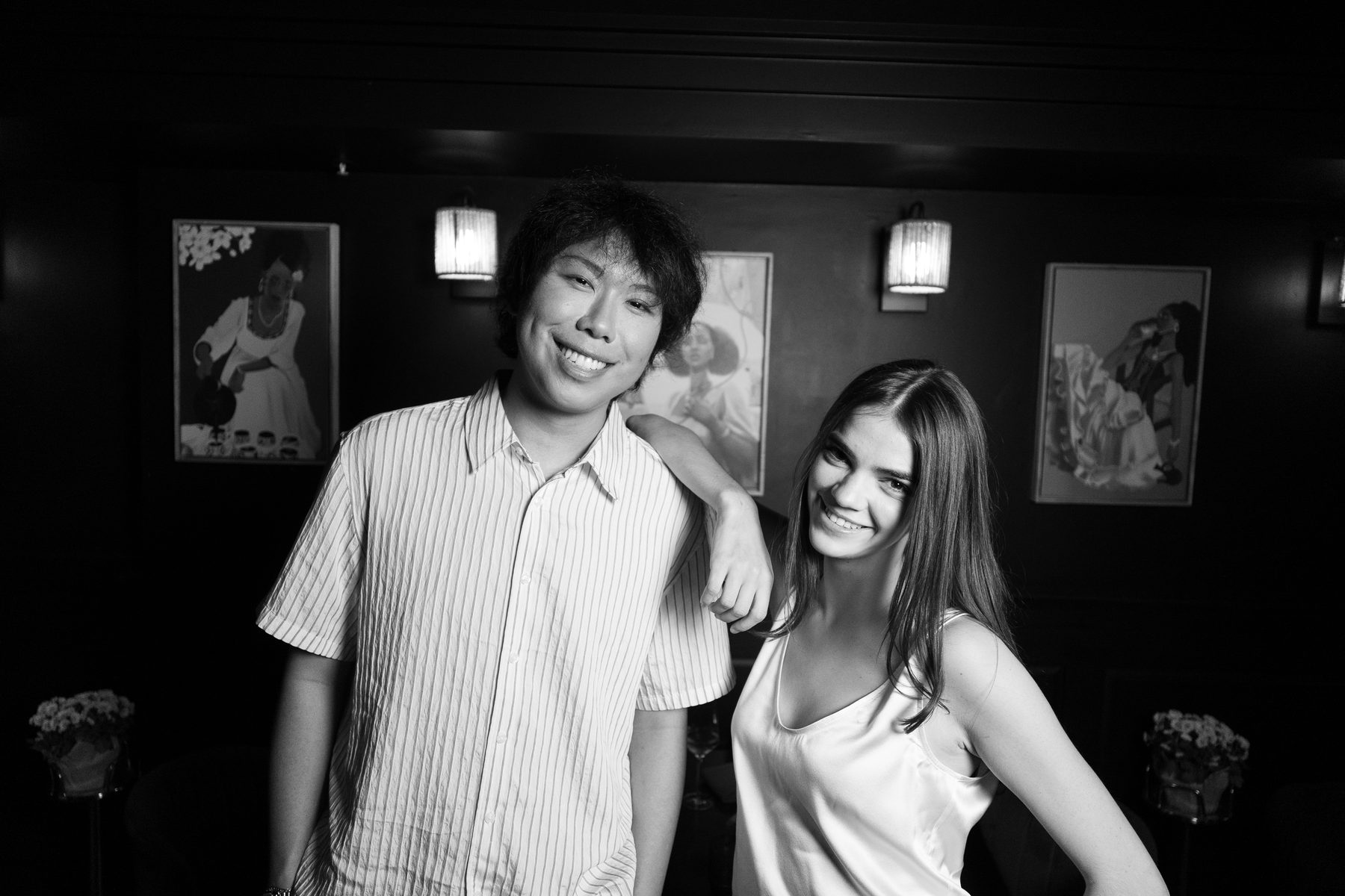 Ryan Deng and Celeste Amadon smiling in the lounge at Meski, his arm on her shoulder.